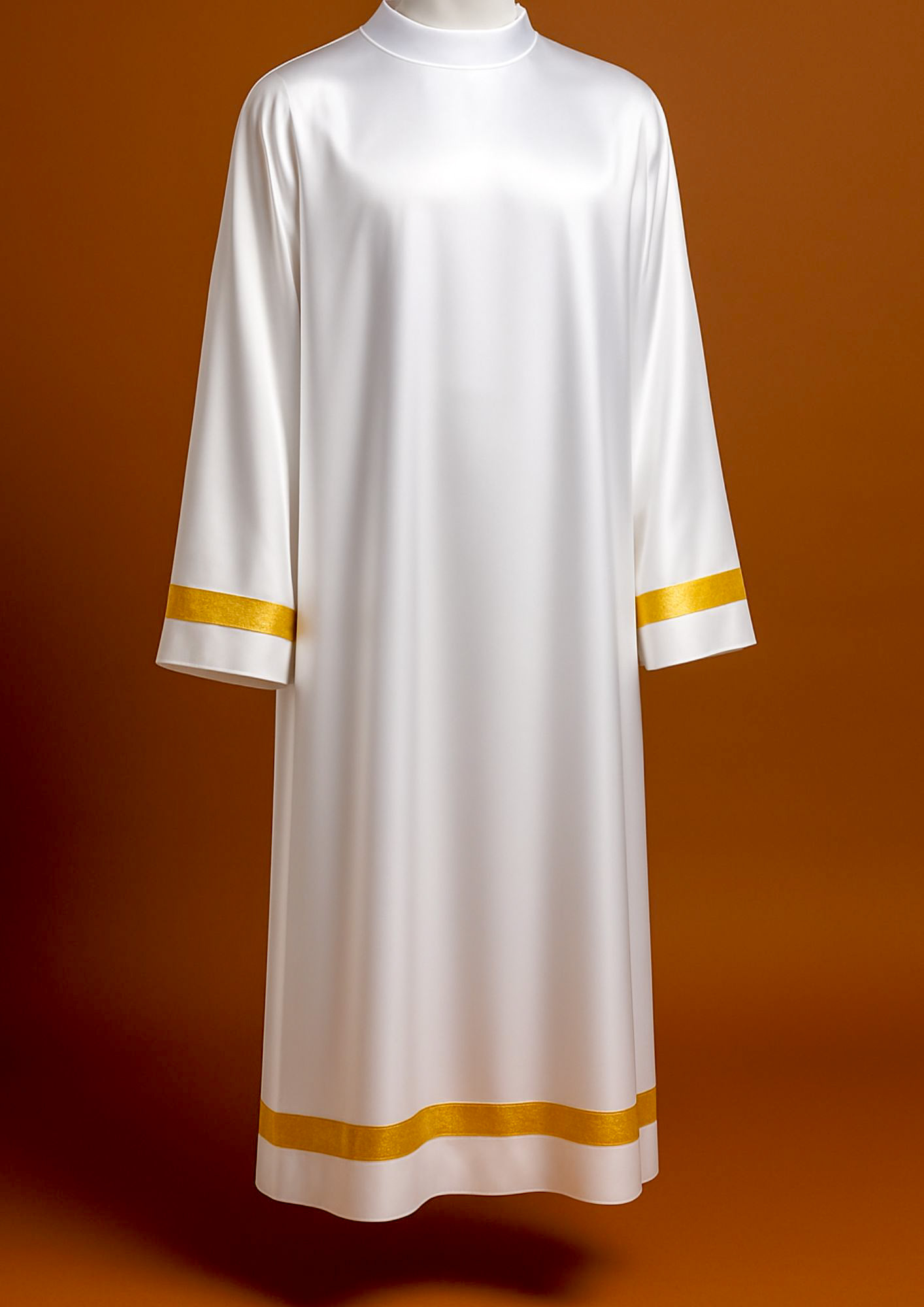  White liturgical alb features distinctive gold banding along the hem and cuffs.  